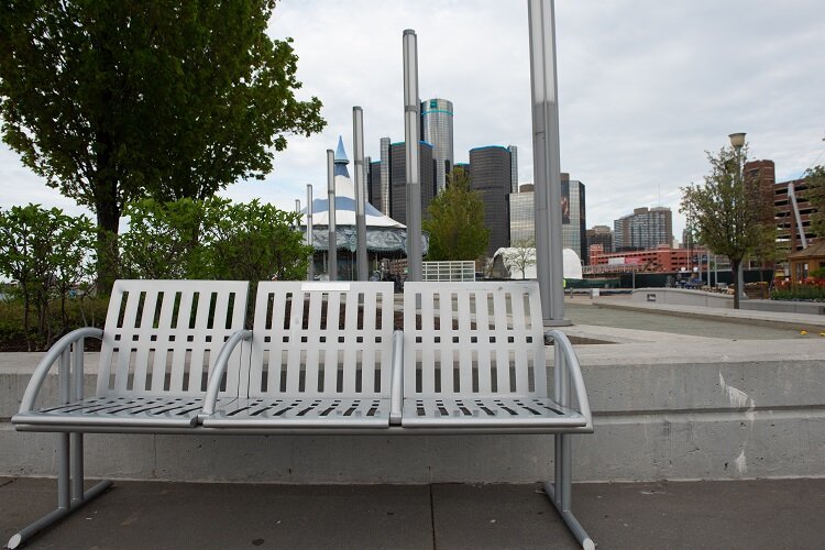 Image of Hostile Design in Detroit. Bench with no space for lying down.